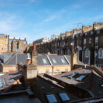 London, England - May 13, 2019: Cityscape panorama of traditional British brick houses.
