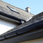 Grey asphalt shingles roof construction with ridge ventilation o